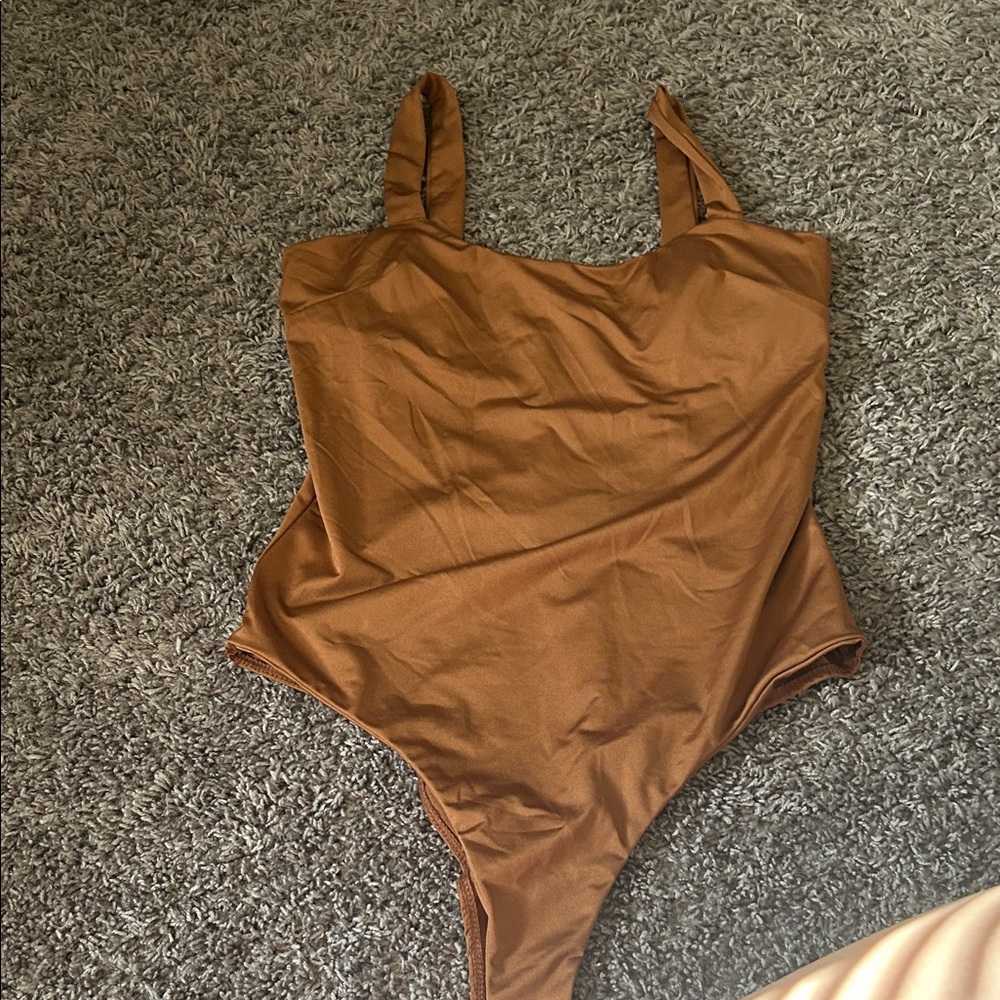 Charlotte Russe women’s Tan One Piece Bodysuit